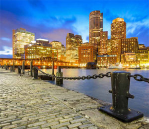 Boston skyline at sunset from Fan Pier