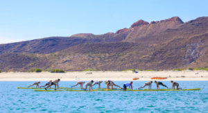 Paddleboard yoga with Lindblad Expeditions’ National Geographic Seabird © LINDBLAD/ JEFF LITTON