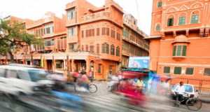 Cars and bicycles in motion on the street in Jaipur