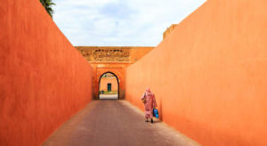 Muslim woman walking through a narrow street