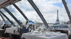 View of the Eiffel Tower from The Peninsula Paris L’Oiseau Blanc rooftop dining room.