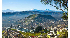 View of El Panecillo in the center of Quito with the Cotopaxi volcano in the background