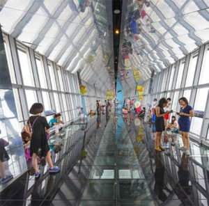 Tourists enjoy the Jin Mao Tower observation deck.