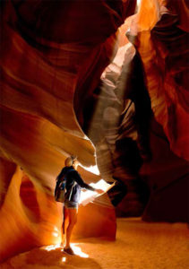 A woman examines a map while exploring in the Grand Canyon.