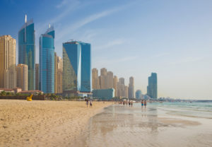 The skyline of Marina hotels from beach in Dubai.