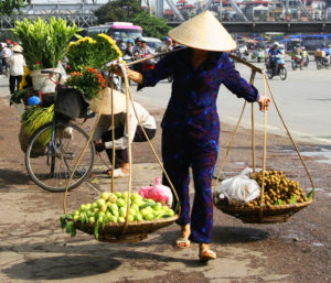 Vietnamese Street Vendor in Hanoi © Koon Hong Kang | Dreamstime.com