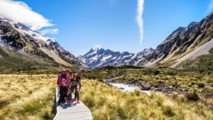 Traveler exploring Hooker Valley track on New Zealand's South Island © Yan Hui Goh | Dreamstime.com