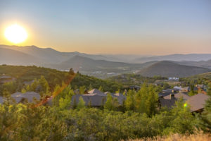 Homes on a hill in Park City, Utah at sunset.