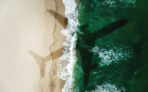 Airplane over the beach, summer