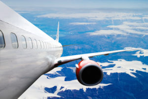 An airplane accending over a dramatic cloudscape.