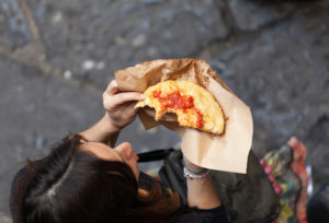 Eating pizza in Naples, Italy