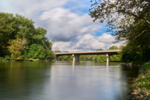 Concrete bridge over fox river on a cloudy day