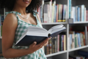 woman reading in bookstore